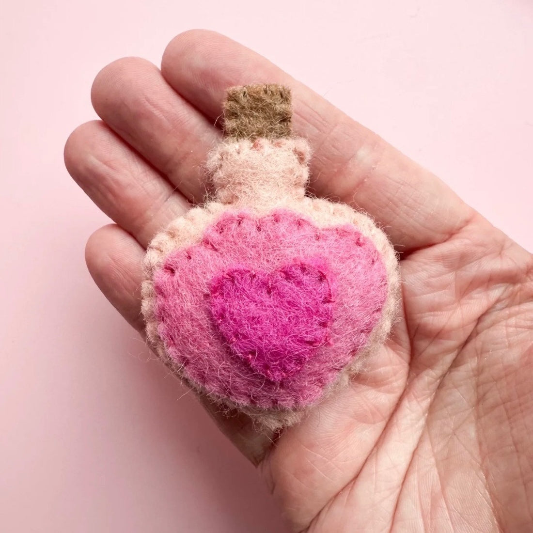 Felt pocket hug love potion bottle