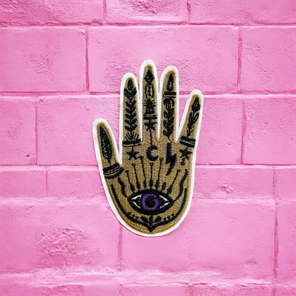 Gold hand purple eye embroidery patch