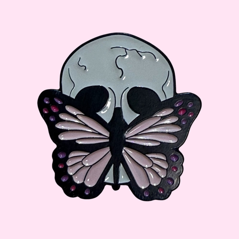 Skull butterfly mouth enamel pin
