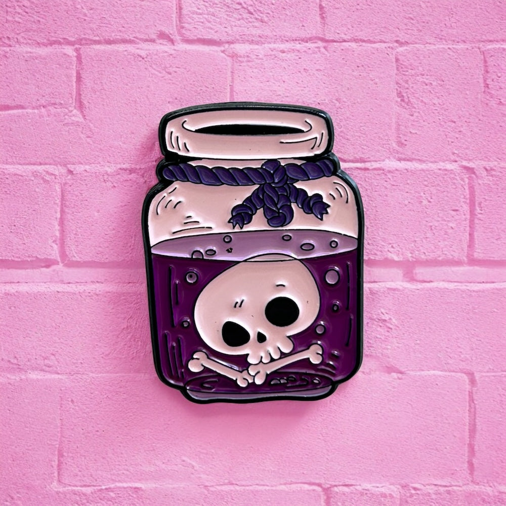 Purple skull potion enamel pin