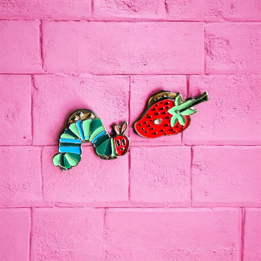 Caterpillar and strawberry enamel pin duo