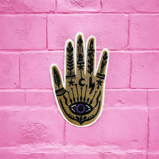 Gold hand purple eye embroidery patch