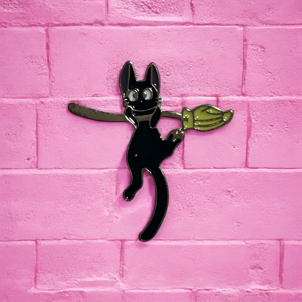 Cat on a broom enamel pin