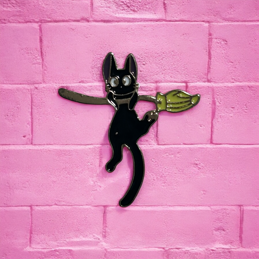 Cat on a broom enamel pin