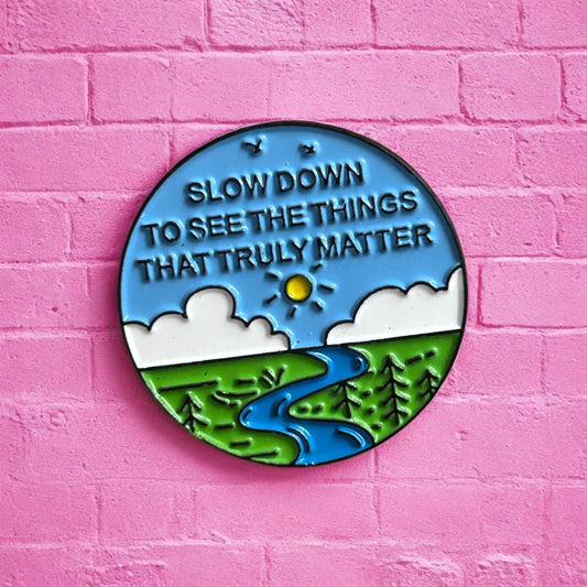 Slow down enamel pin