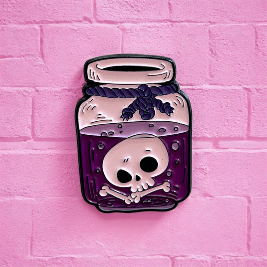 Purple skull potion enamel pin